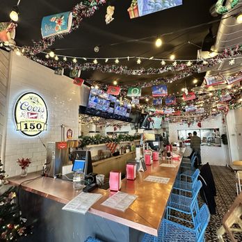 Cemitas El Tigre - Bar decorated for the holidays - Mexican Near Me - Sunnyside, New York Cemitas El Tigre - Bar decorated for the holidays - Mexican Near Me - Sunnyside, New York