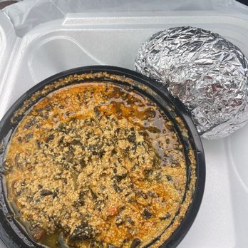 Fork in Nigeria - Goat Egusi Fufu Meal - African Near Me - Detroit, Michigan