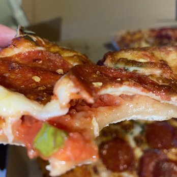 Blackjack Pizza - Raw dough under layer of cheese - Pizza Near Me - Colorado Springs, Colorado Blackjack Pizza - Raw dough under layer of cheese - Pizza Near Me - Colorado Springs, Colorado