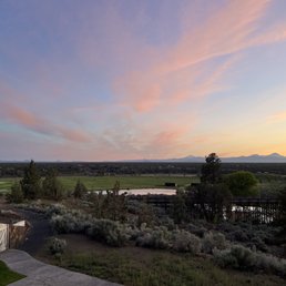a sunset view of a golf course