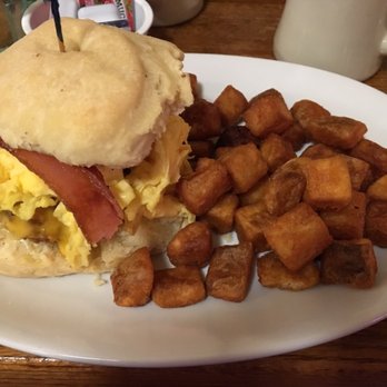 The Diner - Fried chicken covered in cheese topped with egg and bacon on a biscuit with home fries. - Diners Near Me - Washington, DC, District of Columbia