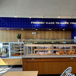 The entry area at the left (from the front). Trays, paper, and tongs are available for each customer at far left.