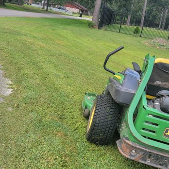 Full Service Landscaping - a lawn mower on the grass - Lawn Services Near Me - Houston, Texas Full Service Landscaping - a lawn mower on the grass - Lawn Services Near Me - Houston, Texas