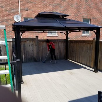 V Star Renovation - a man mopping the patio - General Contractors Near Me