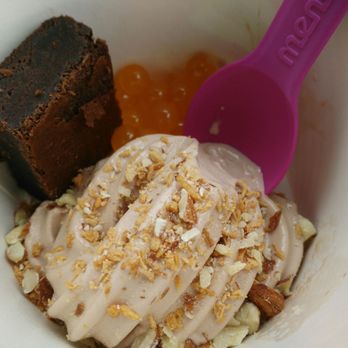 Menchie's Frozen Yogurt - Nutella froyo topped with toasted coconut and almonds, with one brownie (I was good) and mango popping boba on the side. - Ice Cream & Frozen Yogurt Near Me - Toronto, Ontario