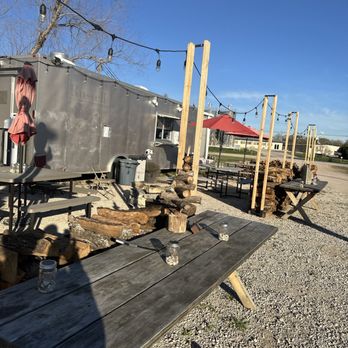 Scot’s Pizza - a woman standing on a picnic table - Pizza Near Me - Burnet, Texas