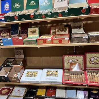 Burn One Cigar Lounge - a shelf of cigars - Cigar Bars Near Me - Baltimore, Maryland Burn One Cigar Lounge - a shelf of cigars - Cigar Bars Near Me - Baltimore, Maryland