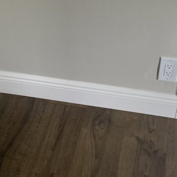 MB Motta Flooring - Typical baseboard/flooring closeup after caulking. - Flooring Near Me MB Motta Flooring - Typical baseboard/flooring closeup after caulking. - Flooring Near Me