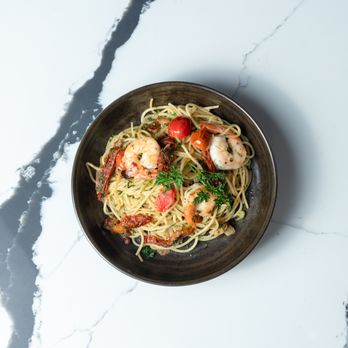Nai Restaurant - a bowl of pasta with shrimp and tomatoes - Mediterranean Near Me - Burlington, Ontario