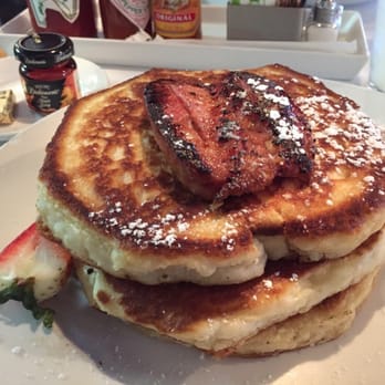 Eat. - Golden-brown pancakes with chicken apple sausage and maple syrup - New American Near Me - Las Vegas, Nevada