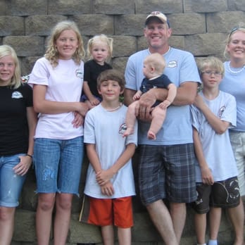 My Plumber - a family posing in front of a stone wall - Plumbing Near Me - Minnetonka, Minnesota My Plumber - a family posing in front of a stone wall - Plumbing Near Me - Minnetonka, Minnesota