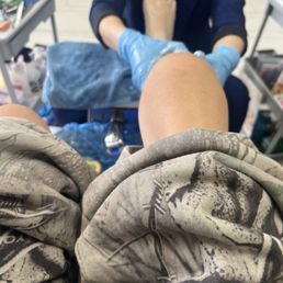 Foot & legs massage with hot rocks and hot towel.