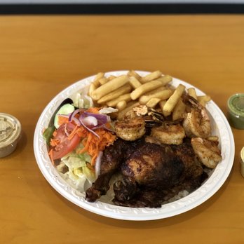 El Pollo Cool - a plate of food on a table - Peruvian Near Me - Pasadena, Maryland