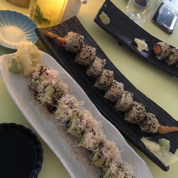 Makoto - Top (half eaten): Salmon Avocado Uramaki; Middle: Shrimp Tempura Uramaki; Closest/Bottom (on White Plate): Caterpillar Uramaki - Japanese Near Me - Miami Beach, Florida
