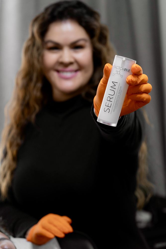 Naturally Beautiful Aesthetics & Wellness Logo