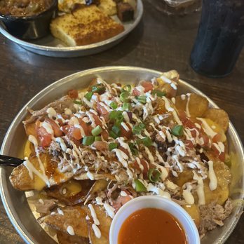 Edley's Bar-B-Que - BBQ nachos; burnt ends with grits and cornbread behind. - Barbeque Near Me - Chattanooga, Tennessee Edley's Bar-B-Que - BBQ nachos; burnt ends with grits and cornbread behind. - Barbeque Near Me - Chattanooga, Tennessee