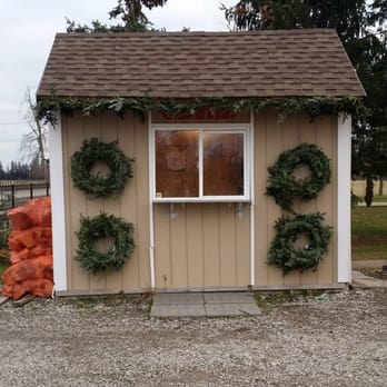 Kennedy Garden Center - a small building with wreaths on the side - Landscaping Near Me - Caledon, Ontario Kennedy Garden Center - a small building with wreaths on the side - Landscaping Near Me - Caledon, Ontario