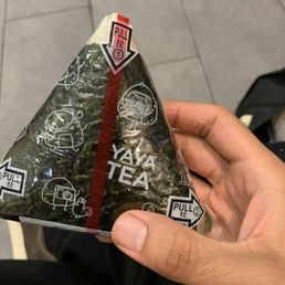 person holding a triangle shaped item person holding a triangle shaped item