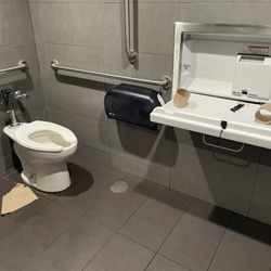 McDonald's - No paper towels in the stall and the empty rolls sitting on the baby changing table