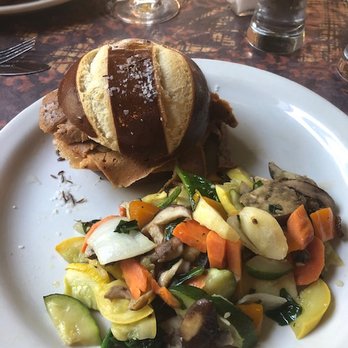 Betty's - Vegan Beef on Weck with a side of vegetables - New American Near Me - Buffalo, New York Betty's - Vegan Beef on Weck with a side of vegetables - New American Near Me - Buffalo, New York
