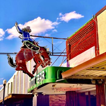 The Mint Bar - a man riding a horse - Bars Near Me - Sheridan, Wyoming The Mint Bar - a man riding a horse - Bars Near Me - Sheridan, Wyoming