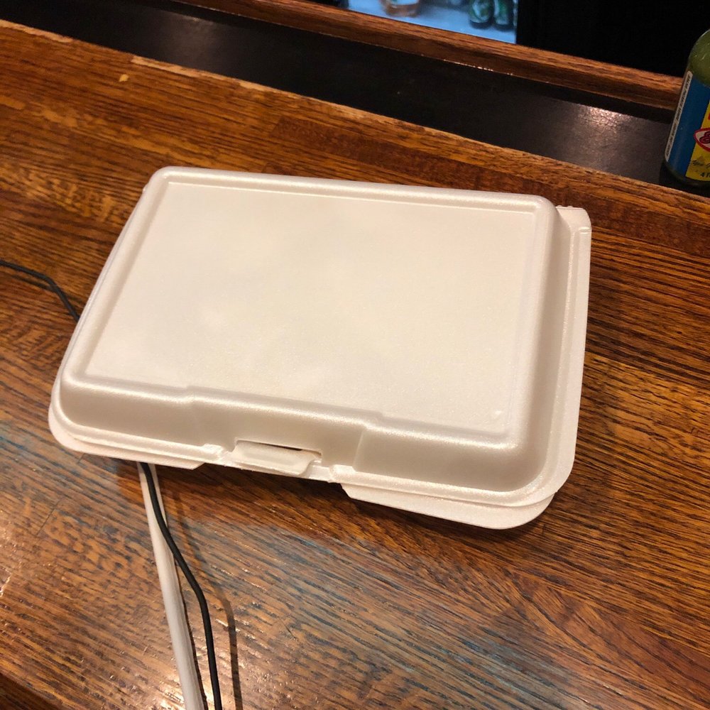 a white tray on a wooden table