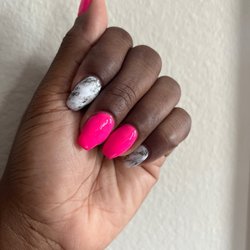 The Nail Den - Pink nails with two marble nails
