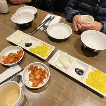 Mokran - people sitting at a table with bowls of food - Korean Near Me - Langley, British Columbia
