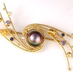 Daniel R Spirer Jewelers - "Black Hole in the Center of a Spiral Galaxy"  18k and 22k gold pin with South Sea black pearl, fancy sapphires and diamonds