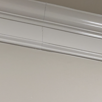 Petra Flooring & Blinds - Another split seam where crown molding replaced. - Flooring Near Me - Houston, Texas