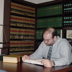 Law Offices of Thomas G Glick - Tom researching the law in books back in the twentieth century.