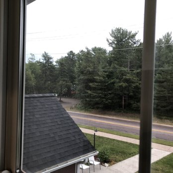 Nestledown Bed and Breakfast - Beach and walking path just through those trees. - Bed & Breakfast Near Me - Marquette, Michigan