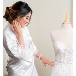 Event Engineers - Our beautiful bride with her dress displayed on our bridal mannequin rental.