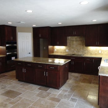 Xtreme Renovations - New travertine natural tile laid on a Chiseled Versailles Pattern with custom Maple Cabinetry stained to an elegant finish. - Flooring Near Me - Houston, Texas Xtreme Renovations - New travertine natural tile laid on a Chiseled Versailles Pattern with custom Maple Cabinetry stained to an elegant finish. - Flooring Near Me - Houston, Texas