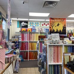 The Yankee Quilter - A rainbow of fabric on the wall, and lots of samples to inspire you