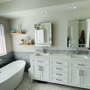 KCK Construction & Remodeling - New mirrors, vanity free standing tub with natural stone accent wainscoting. - General Contractors Near Me - Pleasant Hill, California KCK Construction & Remodeling - New mirrors, vanity free standing tub with natural stone accent wainscoting. - General Contractors Near Me - Pleasant Hill, California