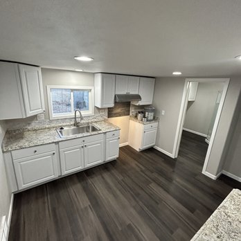 Wyoming All Service - a kitchen with white cabinets and granite countertops - Handyman Near Me - Cheyenne, Wyoming Wyoming All Service - a kitchen with white cabinets and granite countertops - Handyman Near Me - Cheyenne, Wyoming