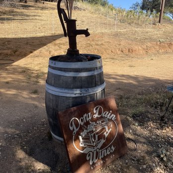 Dora Dain Wines - a wooden barrel with a sign that says dora dain winery - Wine Tasting Room Near Me - Lincoln, California Dora Dain Wines - a wooden barrel with a sign that says dora dain winery - Wine Tasting Room Near Me - Lincoln, California