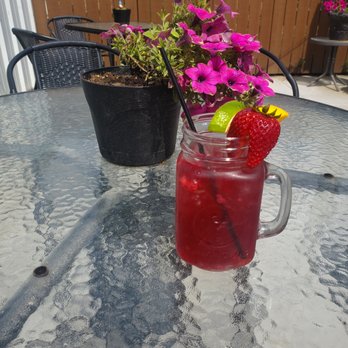 Pete’s - a glass of drink with a strawberries garnish - Barbeque Near Me - Smith Center, Kansas Pete’s - a glass of drink with a strawberries garnish - Barbeque Near Me - Smith Center, Kansas