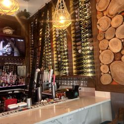 Drift - Entrance with a full wine stock.