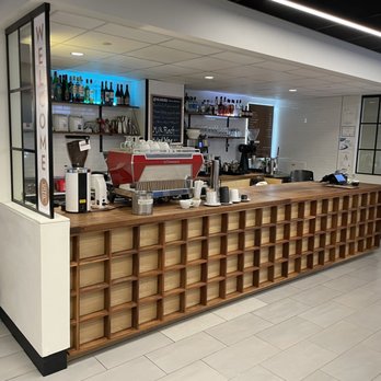 Gracenote Coffee & Wine Bar - a woman sitting at the counter - Coffee & Tea Near Me - Boston, Massachusetts Gracenote Coffee & Wine Bar - a woman sitting at the counter - Coffee & Tea Near Me - Boston, Massachusetts