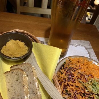 Pierogarnia Stary Młyn - Hummus, bread, mixed salads on plate, beer - Pierogis Near Me - Wrocław, DS Pierogarnia Stary Młyn - Hummus, bread, mixed salads on plate, beer - Pierogis Near Me - Wrocław, DS