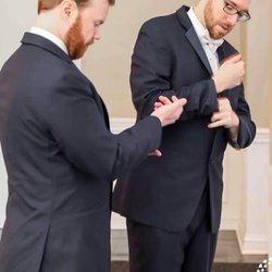Gentlemen's Quarters Formalwear - The groom and best man getting ready
