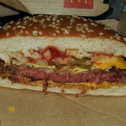 McDonald's - Raw burger I recieved,  on may 8th I ate a whole one and ate half of this one an got terribly sick.