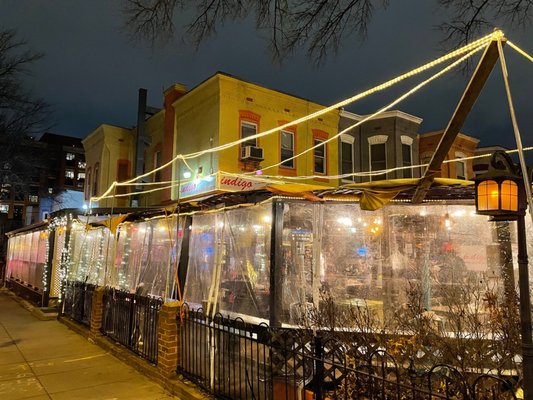 Photo of Indigo - Washington, DC, DC, US. a restaurant on a city street at night