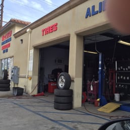 Taken while they prepare to replace tire number two(: Taken while they prepare to replace tire number two(: