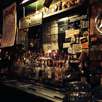 Red Barn Pub - a bar filled with bottles of alcohol - Dive Bars Near Me - Mandeville, Louisiana Red Barn Pub - a bar filled with bottles of alcohol - Dive Bars Near Me - Mandeville, Louisiana