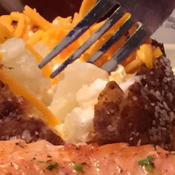Texas Roadhouse - Baked potato with cheese and sour cream, and salmon. - Steakhouses Near Me - Olathe, Kansas Texas Roadhouse - Baked potato with cheese and sour cream, and salmon. - Steakhouses Near Me - Olathe, Kansas
