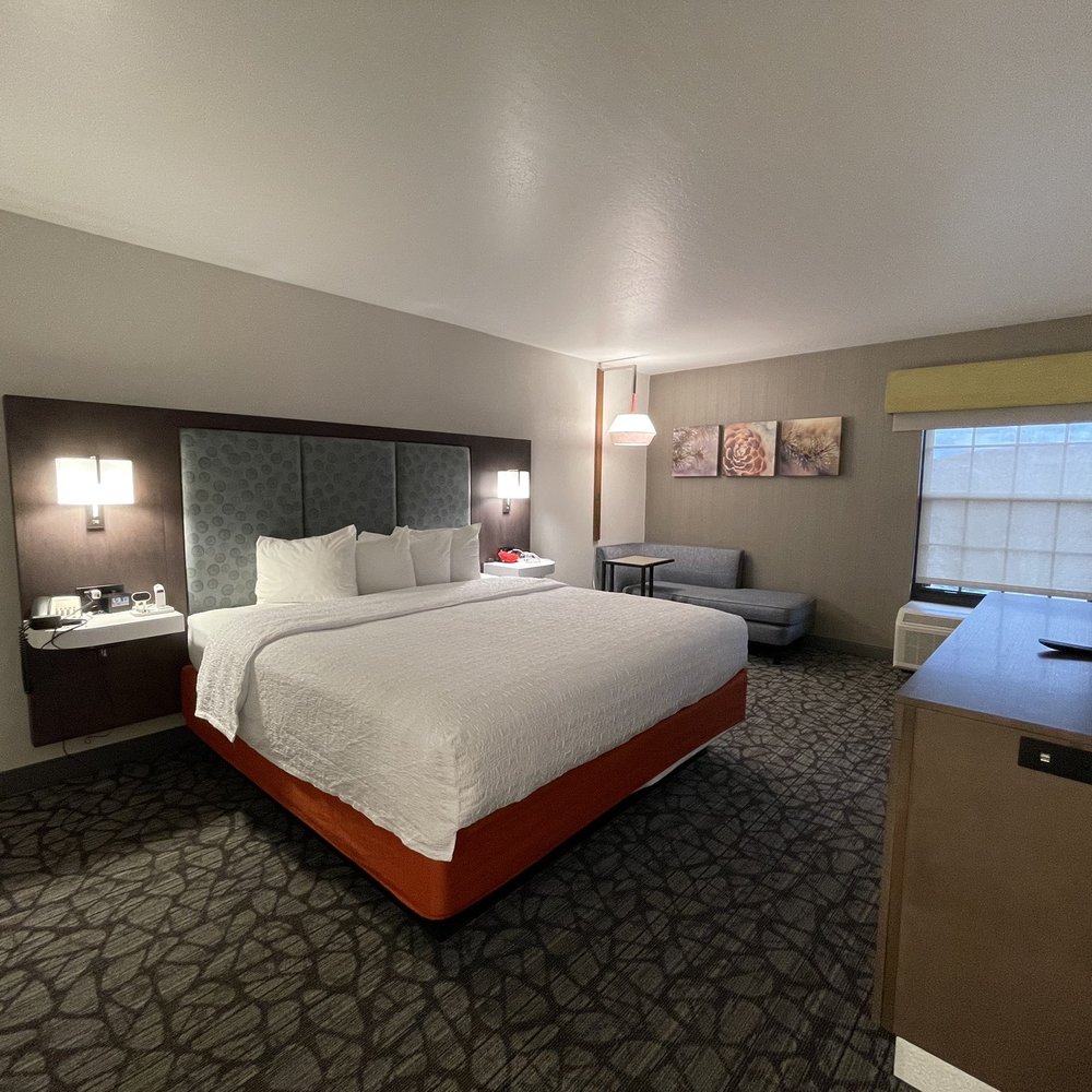 The bedroom suite is large, comfortable, modern, and inviting.