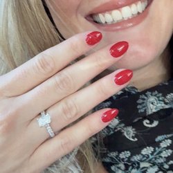 Beautiful engagement ring and a very happy smile.